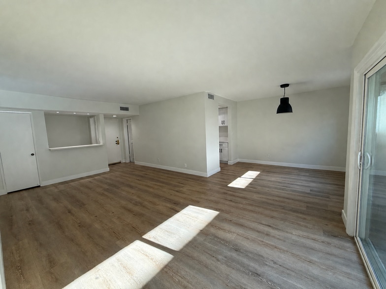 Separate dining room and living room with wet bar and extra coat closet - 1203 N Sweetzer Ave
