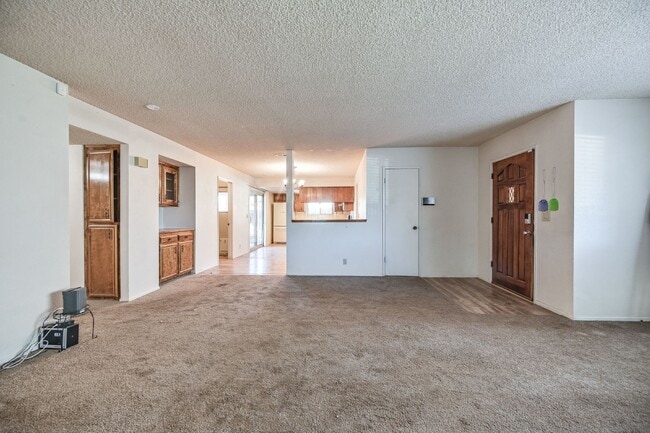 Building Photo - 3 bedroom, 2 bath with large living room and brick fireplace.  Good size kitchen with tons of cab...