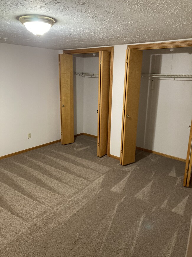 Bedroom with closet space - 7065 Starcliff Ave NW