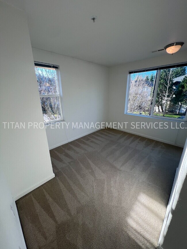 Building Photo - Beautiful Three Story Townhouse with Gas Fireplace, Balcony & 2-Car Garage