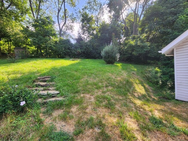 Building Photo - 4 BR home with first-floor living, new roof, and a private-feeling backyard in Lincoln Place