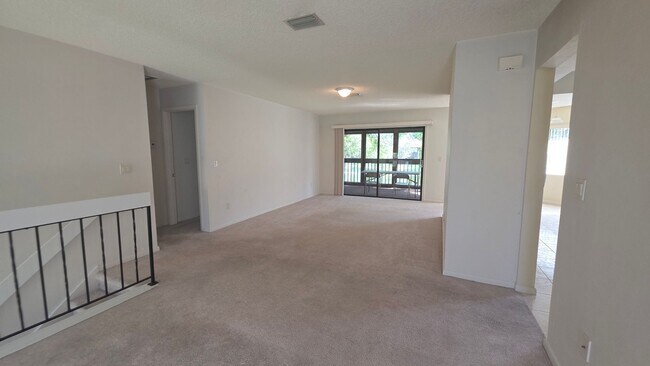 Building Photo - Beautiful Pond Front 2 Bedroom 2 Bath Townhome in the Wood Haven Community