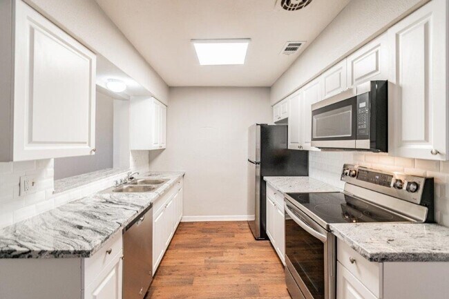 Building Photo - PRICE JUST REDUCED 3/2/1 1389 Sq. Ft. on a huge corner lot with granite & custom tile work!!