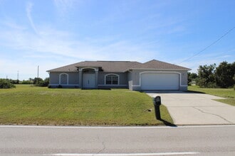 Building Photo - ** FIRST MONTHS RENT FREE** Quiet and Spacious Single Family Home in NW Cape Coral