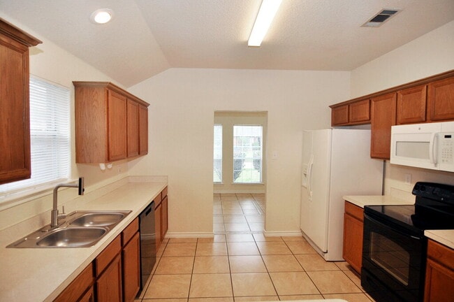 Building Photo - "Warm And Welcoming 3-2-2 With Open Living In a Prime Location!"