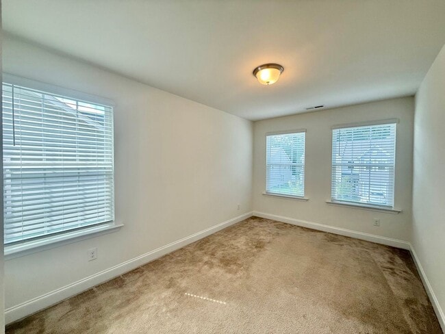 Building Photo - Spacious 3BD, 2.5BA End Unit Raleigh Townhome Near White Oak Shopping Center, I-40, and Downtown ...