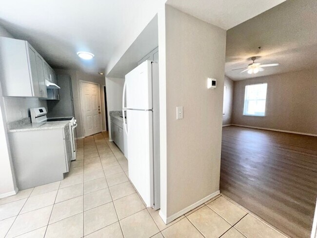 Building Photo - NEW-Remodeled bathroom & kitchen! NEW VINYL PLANK flooring & fresh paint! 2 bedroom 1 bath condo ...