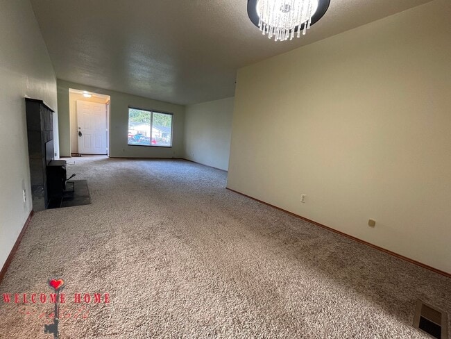 Building Photo - Beautiful Remodeled Rambler!!!  Come enjoy this HUGE backyard!!  NEW CARPET!!