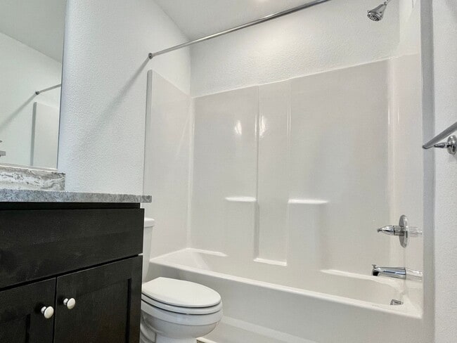 Building Photo - Practically New & Available NOW! Americana Luxury Townhomes! Pet Friendly! Attached Garage! All A...