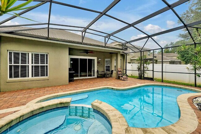 Building Photo - "Stunning 3BR Orlando Home with Private Screened Pool, Spa & Spacious Living Areas"