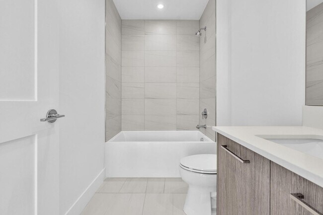 Building Photo - Stunning High-Rise Condo with Ocean Views | Prime Beach Location