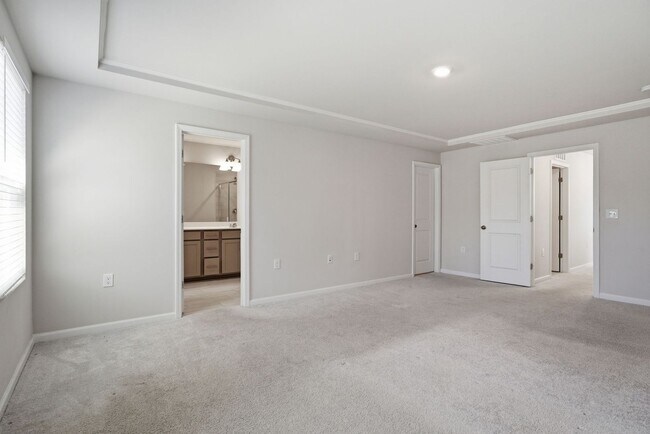 Building Photo - Upgraded 3BR Townhome in Wake Forest | Open Layout, Garage & Resort-Style Amenities