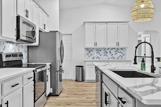 Building Photo - Modern 4-Bedroom, 3-Bath Home with Private In-Law Suite – Palm Coast, FL