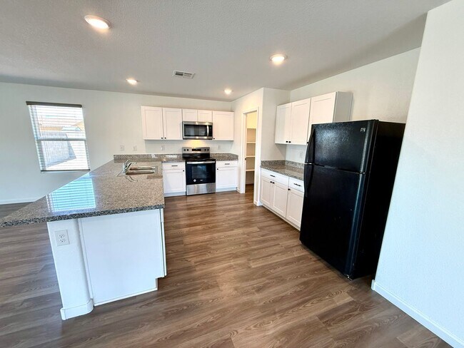 Building Photo - Spacious 4 Bedroom Home with Solar & Modern Upgrades- Available Now!