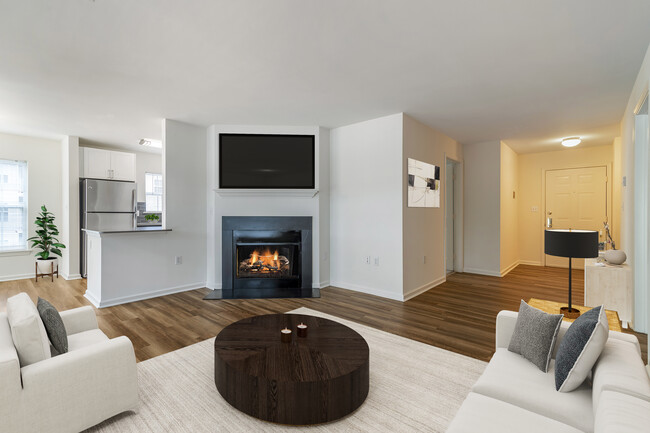 Renovated Package II living area with hard surface plank flooring - eaves Wilmington and Wilmington West