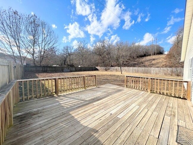 Building Photo - Single Family Home with a fenced in backyard!