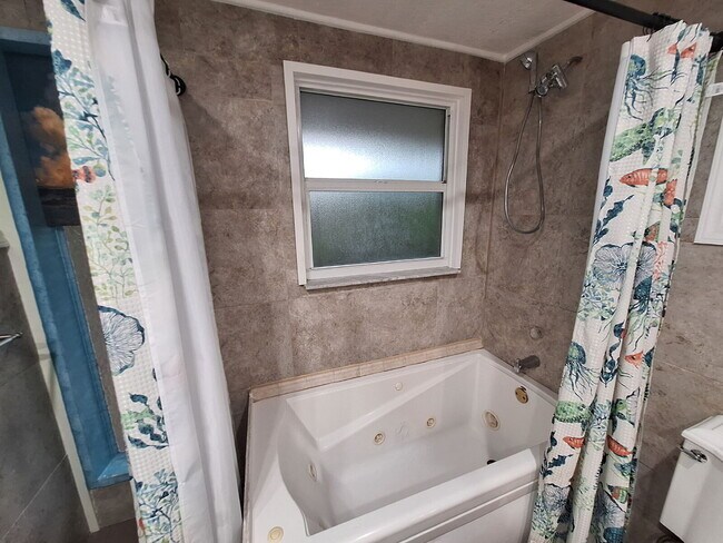 Building Photo - Gulf Access Home on Canal Available Now
