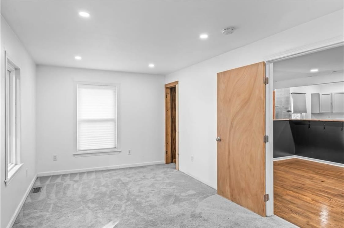 Primary bedroom facing east, view of door and closet - 600 Ridgeview Ave