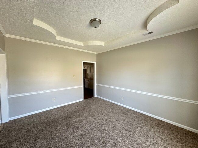 Building Photo - Grand 4BR/2BA Near Southwind | 2,438 Sq Ft, Stone Fireplace, Soaking Tub & 2-Car Garage