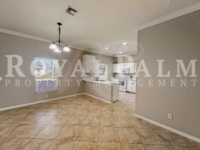 Building Photo - 3BR/2BA Home Ready to Bloom in Lehigh Acres + GARAGE!!