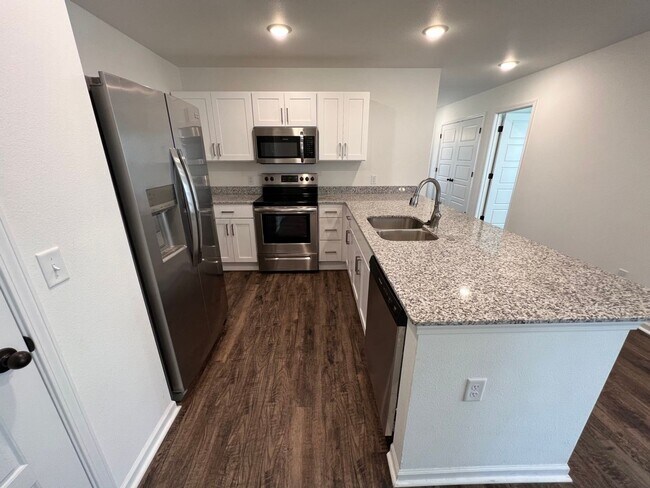Building Photo - New 3 Bedroom Townhome ($999 Per Month)