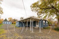 Building Photo - Comfortable 3-Bedroom Home with Fenced Yard and Attached Carport
