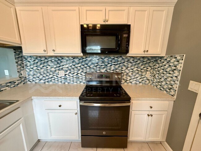 Building Photo - Fully Renovated 2BR Brick Home with Vaulted Ceilings & Backyard Retreat!