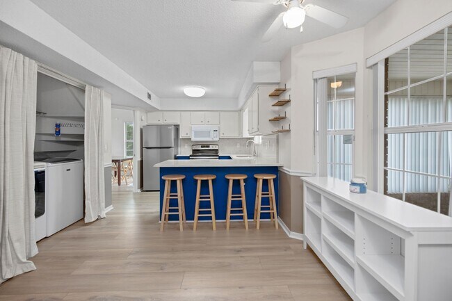 Building Photo - Spacious 3BR Retreat with Soaring Ceilings & Screened Porch