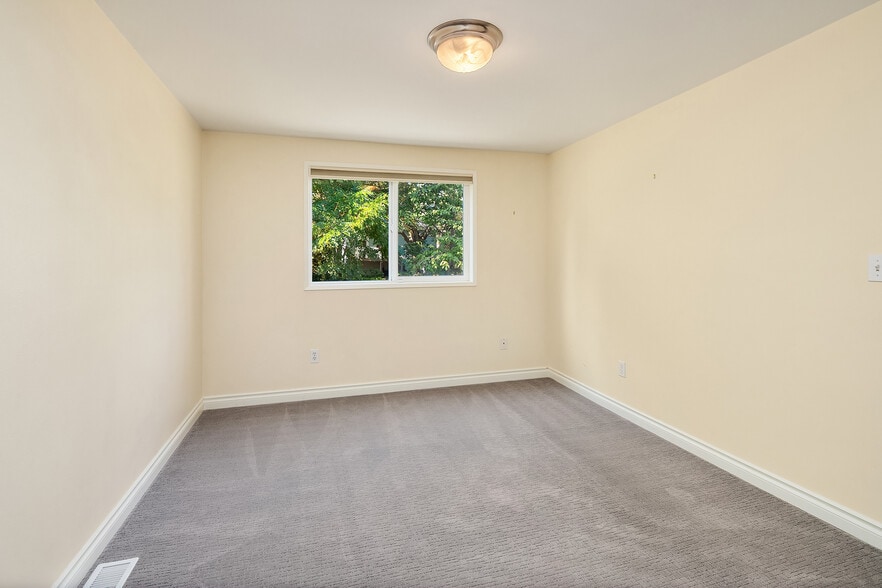 Master facing back garden. - 7051 8th Ave NW