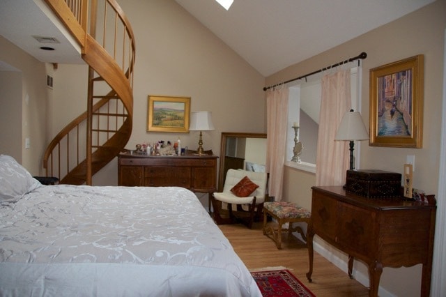Primary bedroom with spiral staircase to loft - 51 Stacey Cir