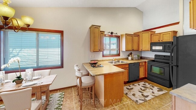Building Photo - BEAUTIFUL 4 BD, 2 BA TOWNHOME WITH A FULLY EQUIPED KITCHEN, VAULTED CEILINGS, FIREPLACE, ATTACHED...