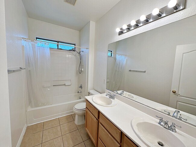 Building Photo - 4 BEDROOM HOME 3 CAR GARAGE ON A CORNER LO...