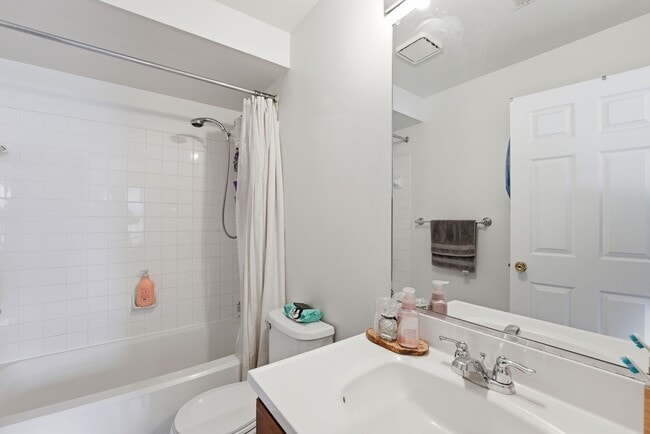 Building Photo - Bathed in natural light, this stunning second level condominium offers an effortless blend of com...