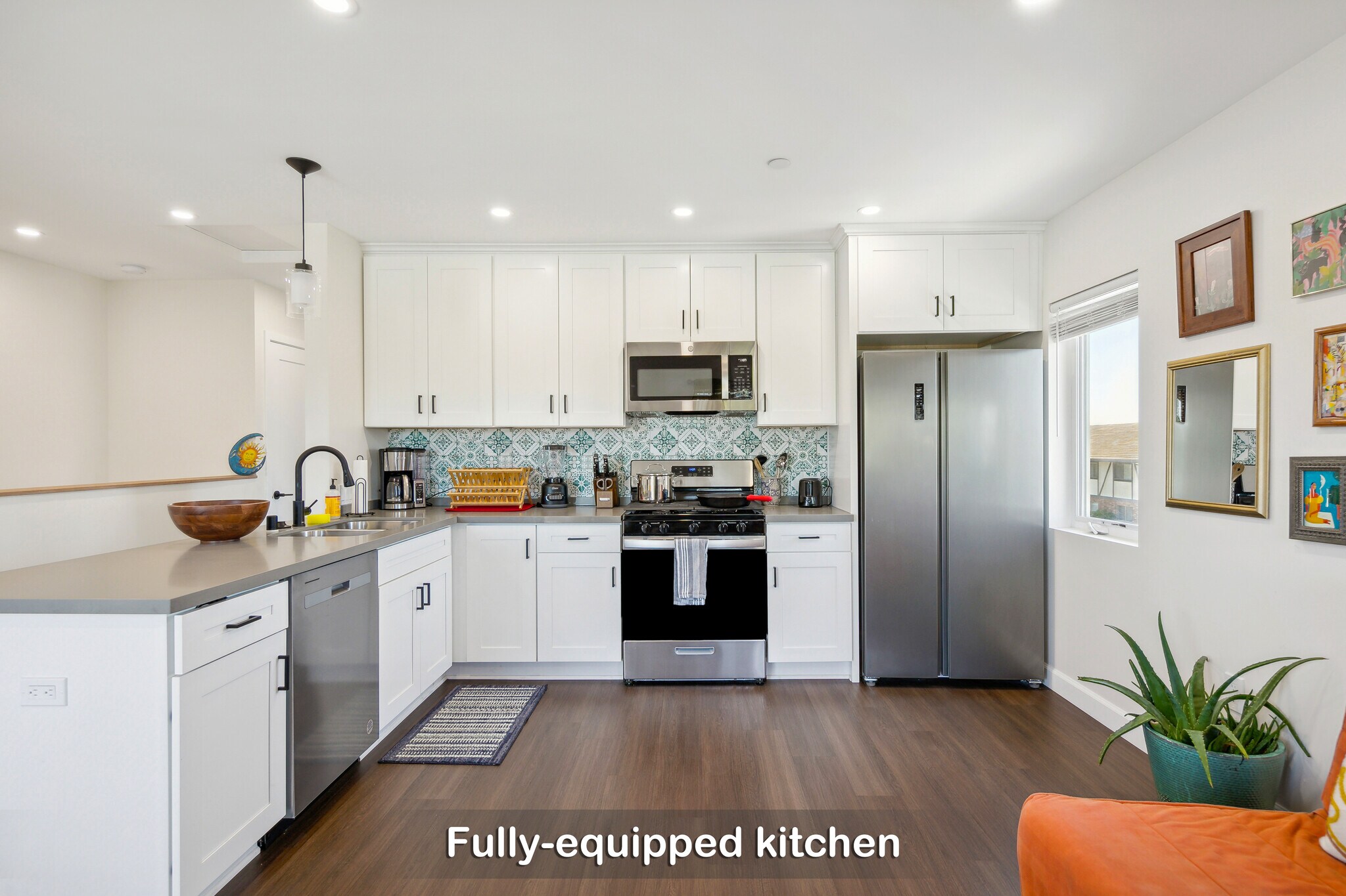 You have everything you need to prepare meals in this fully equipped, modern kitchen. - 721 E 22nd St