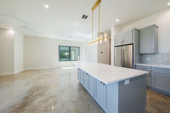 Building Photo - Luxury Redefined: Experience Vibrant Living in this 3-Bedroom Haven in East Austin