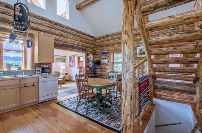 Building Photo - Charming Log Cabin and Carriage House – Do...