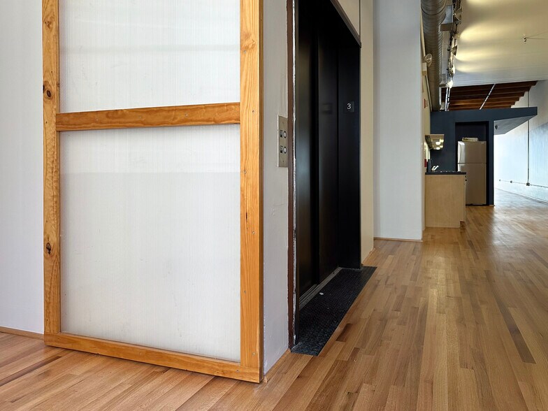 Sliding door at the elevator landing - 945 Liberty Ave