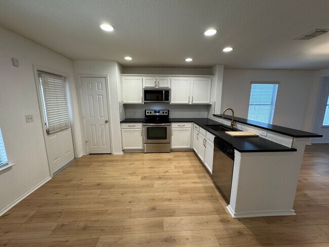 Building Photo - CUTE ONE STORY FEATURING WOOD STYLE VINYL ...