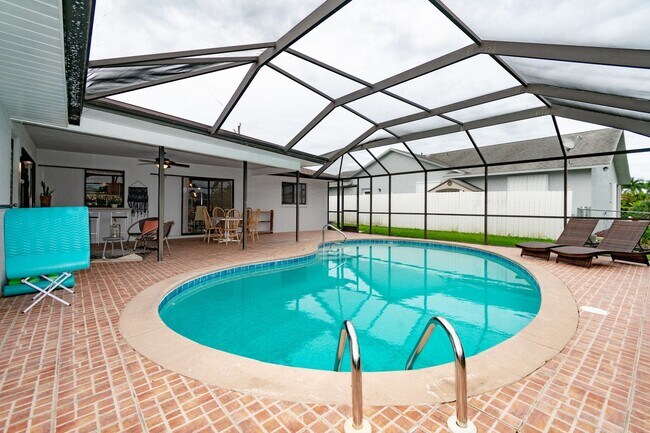 Building Photo - Gulf Access Pool Home. 4BED/2BATH. SE OF CAPE CORAL FL. Special Offer! Qualify for a deposit-free...