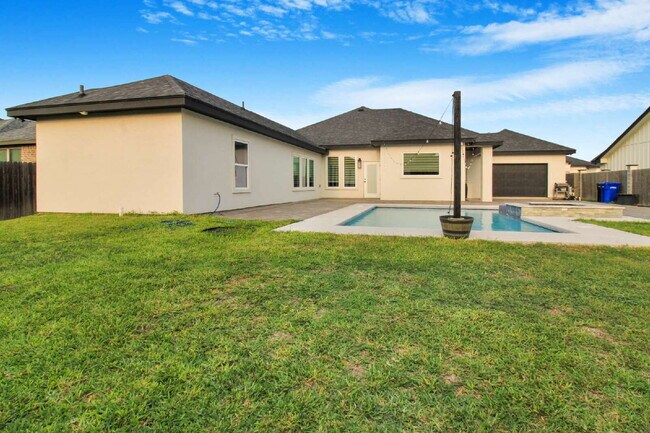 Building Photo - "Luxurious 4-Bed Oasis with Pool & 3.5 Baths in McAllen's Prime Locale!"