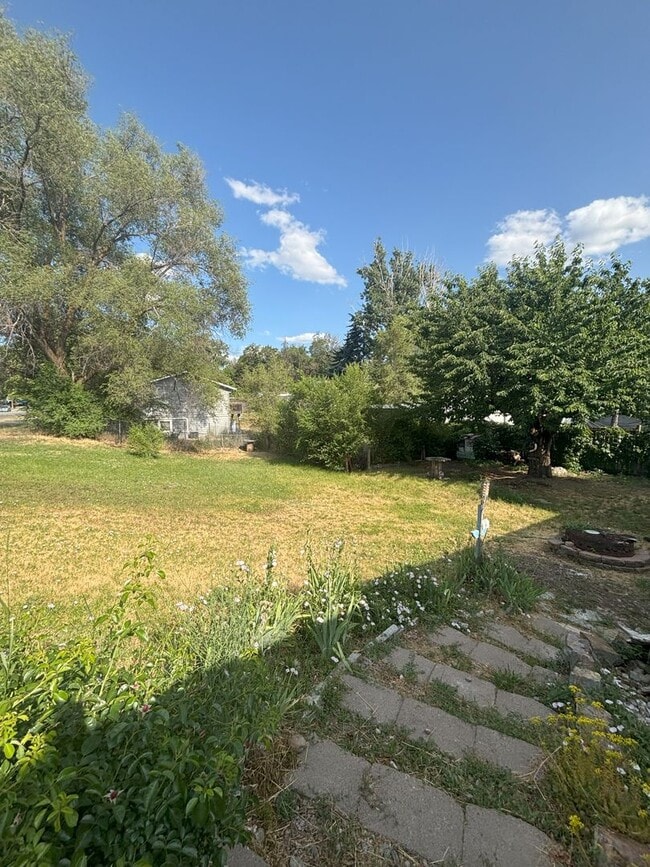 Building Photo - Cozy 4BR Home with Extra Space & Outdoor C...