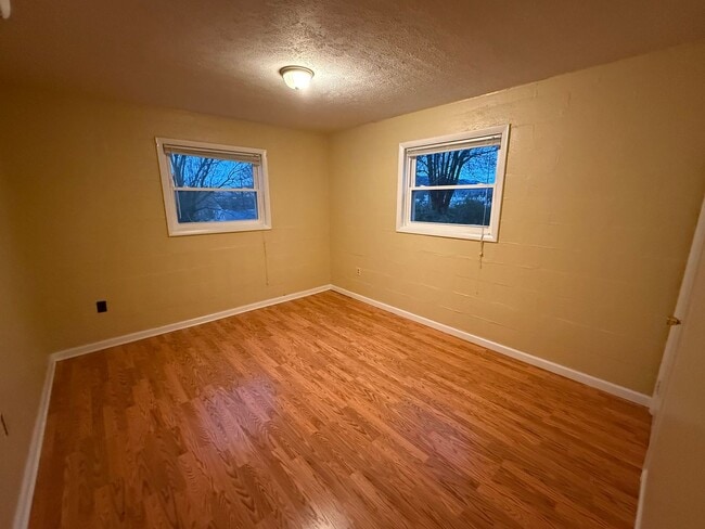 Building Photo - Updated 4BR Home with Finished Basement & Level Yard