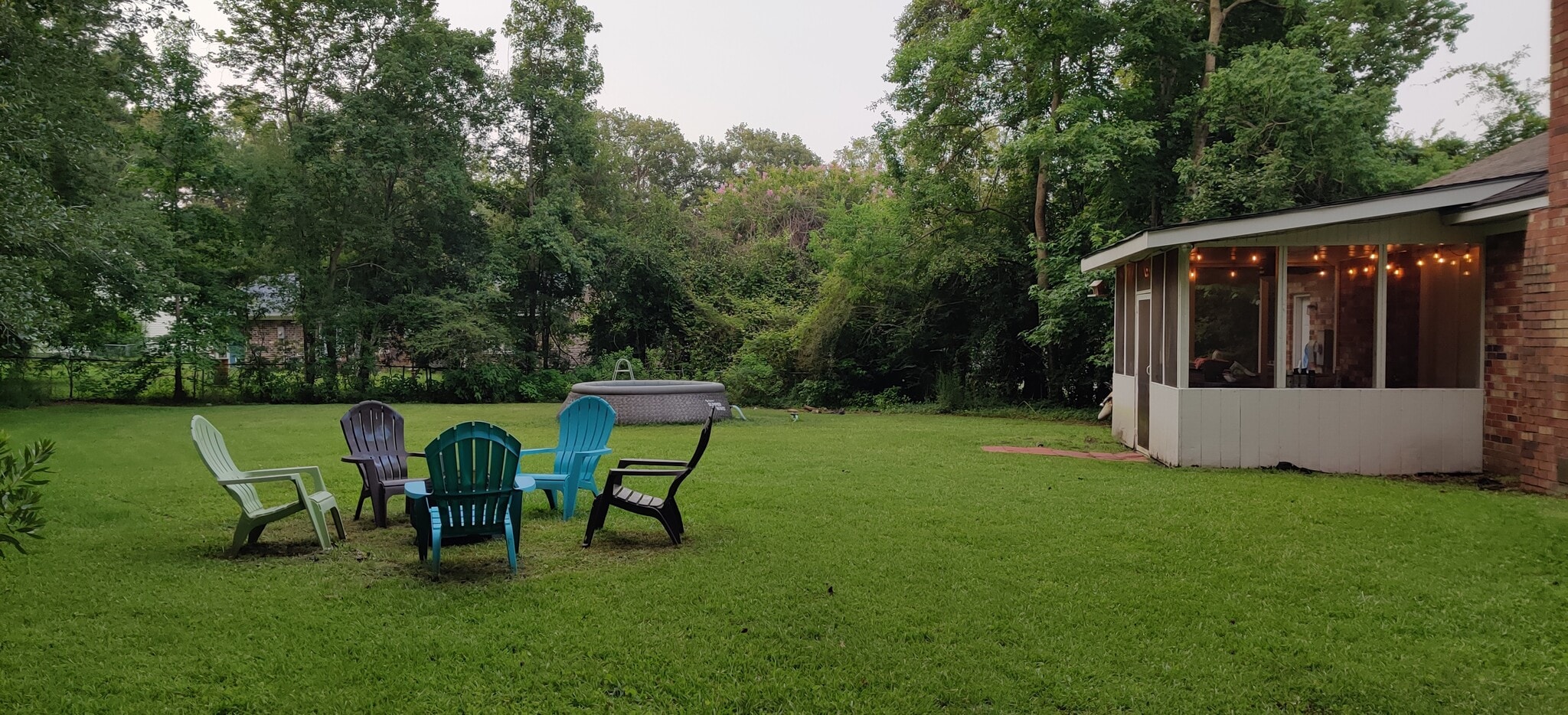 fully fenced back yard with privacy bushes/trees - 102 Anna Ct