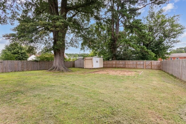 Building Photo - Charming brick rancher with modern kitchen...