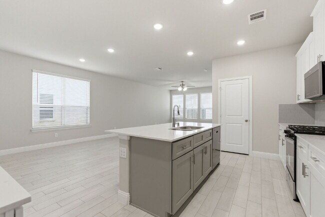 Building Photo - "Open-Concept 4-Bedroom, 2.5-Bath with Designer Finishes and Peaceful Greenbelt Views!"