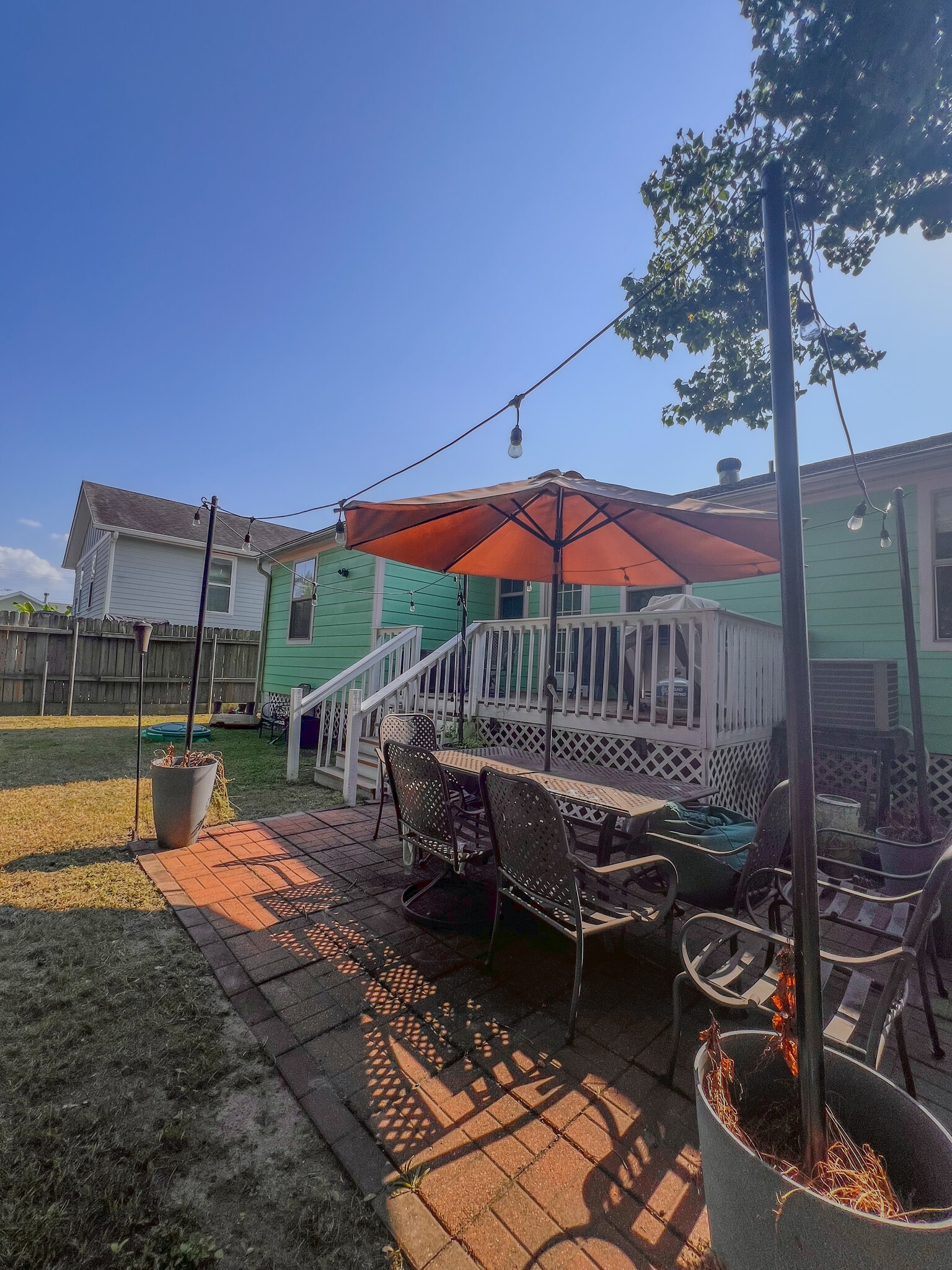 Massive landscaped backyard with playground, trees, patio, deck - 5717 Pasteur Blvd