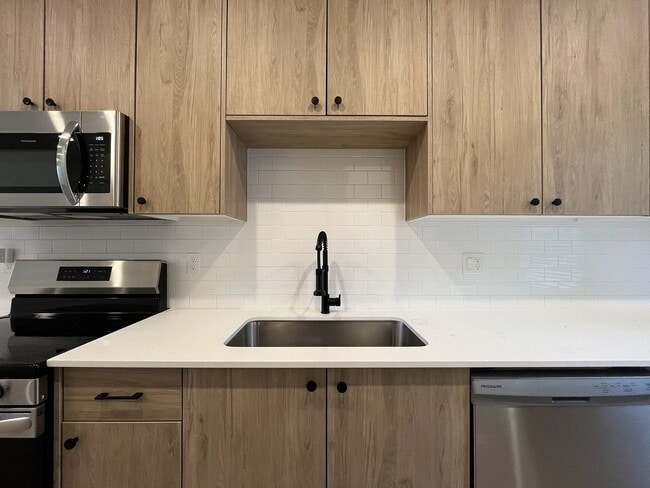 Building Photo - Modern 2-Bed, 1.5-Bath Condo with Custom Kitchen, Private Patio, and Prime Location