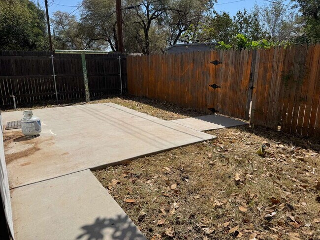 Building Photo - "Charming 4-Bed Lubbock Retreat: Granite Kitchen, Hardwood Elegance & Cozy Fireplace!"