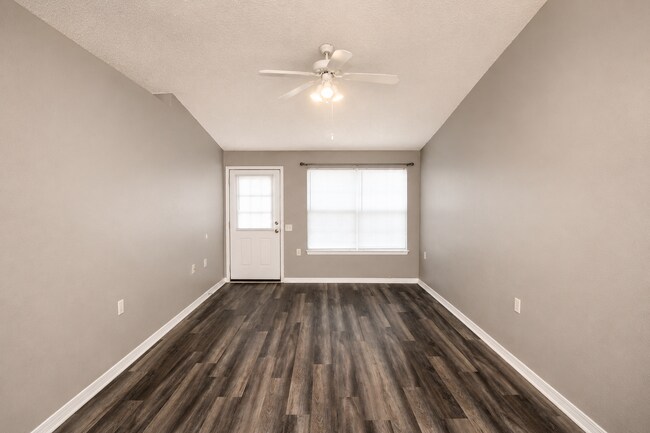Building Photo - 2BR Patio Home with LVP Flooring, Private Fenced Yard, & Convenient Blue Angel Pkwy Location Near...