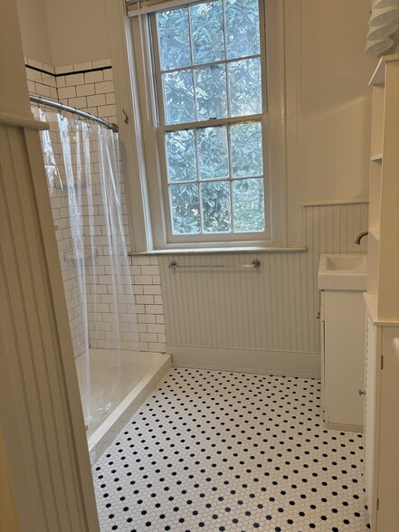 Bathroom shower & sink w/ new tile floor! - 1445 S 4th St